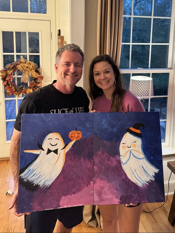 Couple holding their finished Always Be My Boo ghost date night diptych