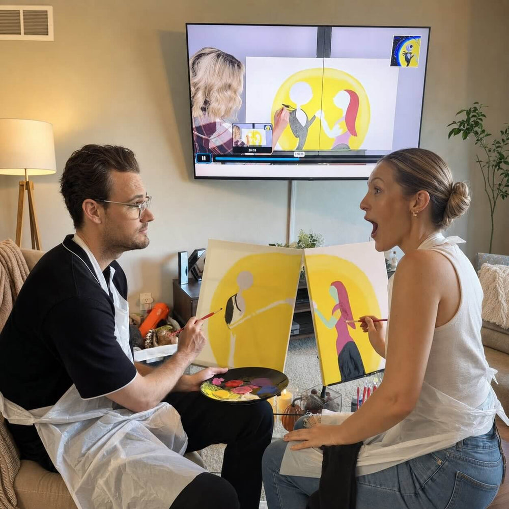 Couple painting the We're Simply Meant to Be Jack and Sally diptych along to the artist tutorial on their TV
