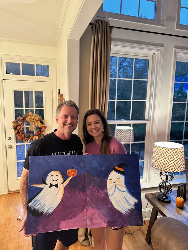 Couple holding their finished Always Be My Boo ghost date night diptych
