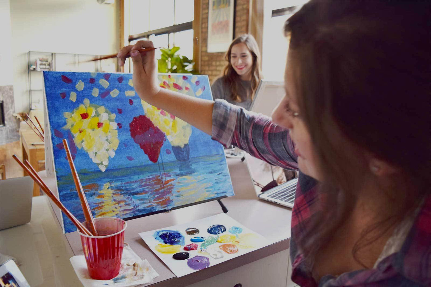 Women Enjoying Paint Night at Home Kit